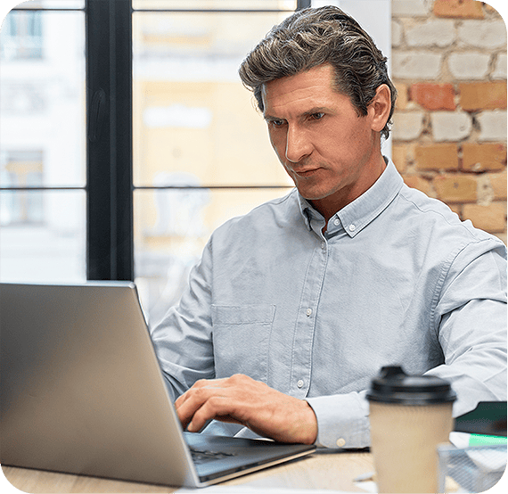 Cyber expert working on a laptop